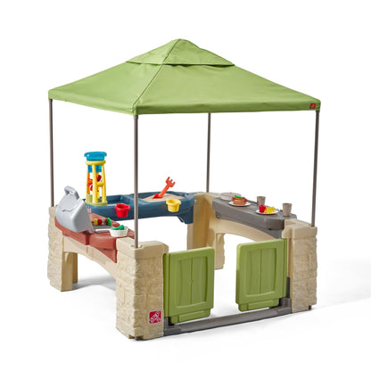 Step2 All Around Playtime Patio with Canopy, Kids Indoor/Outdoor Kitchen Playset & Sensory Playhouse, Made of Durable Plastic, Includes 16 Piece Toy Accessories, for Toddlers 2+ Years Old